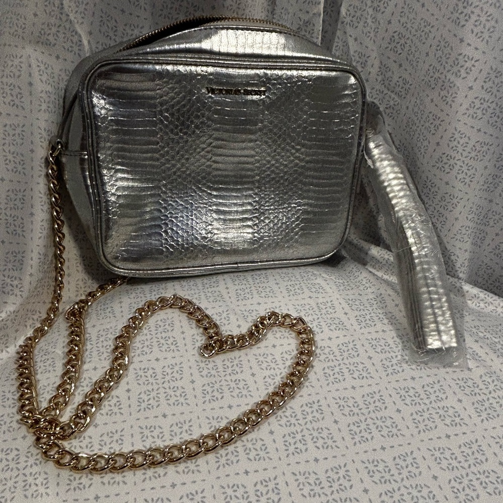 NWOT Victoria Secret silver purse w/gold chain strap.